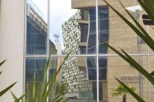 The Cheese Grater reflected in the windows in the Peace Gardens