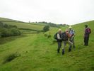 The old Drovers Road eventually crosses a field to a double metal gate onto a farm road.