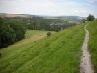 Looking back over Kingston village with Lewes in the distance. The new windmill can be seen in the middle of the photograph. Photograph taken at (C)