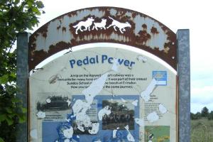 Infromation board commemorating Tommy Simpson.  Board is where the cycle track crosses Pesspool Lane