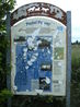 Infromation board commemorating Tommy Simpson.  Board is where the cycle track crosses Pesspool Lane