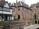 The remains of the Priory in front of the half-timbered Lychgate cottages and the stone Bluecoat School.