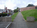 View of the footpath leading towards the red sandstone wall
