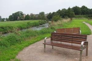 A seat by the River Trent on Crown Meadow nature reserve