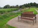 A seat by the River Trent on Crown Meadow nature reserve