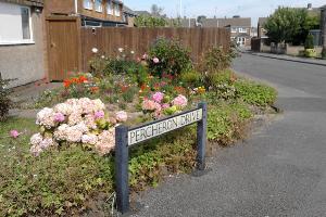 One of the well kept gardens and the street name sign for Percheron Drive.