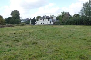 View across Harlow Common towards White Horse public house