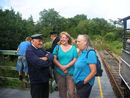 The first walkers ever to board the train at Worth halt discuss railway matters with the train crew