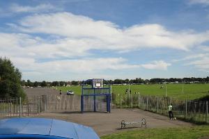 From the Wheels Park, a view of the runway, with the path back to the hospital on the right.