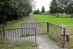 Looking north along the cycle path from the gate of the Community Farm.