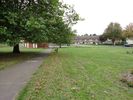 Looking from Ridingleaze across the grassy area to Long Cross.