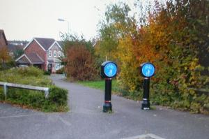 Go through these pedestrian/cycle markers at way point 6
