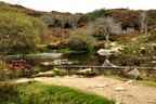 Haytor Quarry Pool showing the remains of the iron winch and broken wooded boom of the derrick.