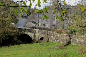 Airton Bridge with coverted mill beyond.