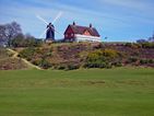 Reigate Heath windmill which dates back to 1765 and is believed to be the only windmill in the world that is also a consecrated church. Alongside is the Reigate Heath golf club clubhouse - the route passes just to the South of these.