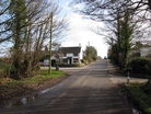 High Offley Road looking towards Woodseaves crossroads. The white building on the left is the former Wesleyan chapel
