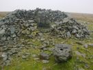 The shelter and remains of trig point on Moel Wnions