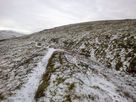 The path alongside the trench on the side of Moel Wnion.
The route to the summit leaves at this point