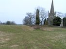 Elmley Lovett Church and the site of the medieval village. The raised platform on the left was the former site of a moated manor house.