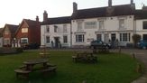 The village green is a nice place to sit and have a drink at the end of your walk.