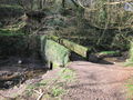 Ancient stone footbridge in woods near Wivelscombe