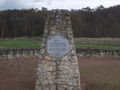 Peter Fidler Cairn with Bolsover Castle behind.