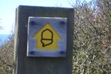 An Acorn way-mark which you follow up the coastal path