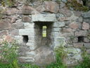 An arrow slit seen from inside the defensive wall.