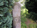 Central Stone of 8 Holymoorside Millennium Boundary Stones, in Village Hall car park.
