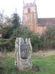 Carved tree trunk seat in Millenium Green by Martley Church
