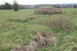 Pillbox near the perimeter track of the airfield. The remains of a zig-zag trench linking the line of pillboxes can be seen in the foreground