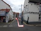 Photo 3.  Just when you get into sight of the promenade, turn right along Gun Street.  Notice the old cannon standing upright by the corner of the building. Then bear left passing the Oldfellows Hall and walk along the promenade.