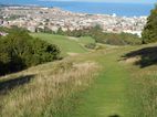 The final descent towards the Royal Eastbourne golf course