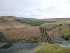 Looking along the Burbage Brook Valley towards Burbage Bridge (in the far distance) with Higger Tor on the left and Burbage Rocks on the right.