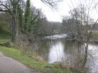 The path alongside the River Derwent on the approach to Harper Lees.