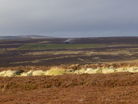 Totley Moor with Stanage Edge in the far distance. Note the ventilation shaft (complete with condensation) of Totley Tunnel in the centre.